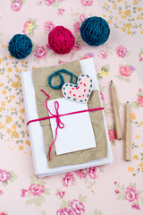 Old notebook for love notes and bright yarn balls