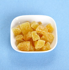 Candied ginger in white bowl