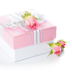 Gift box with a silver bow and roses