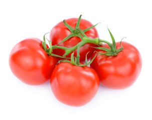fresh tomatoes with green leaves isolated on white background