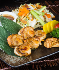 japanese cuisine. grilled shell fish on the background