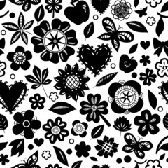 Black and white flowers and hearts silhoettes seamless pattern