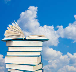 A stack of books against the sky