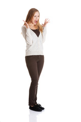 Fototapeta premium Beautiful positive and casual woman expressing surprise.