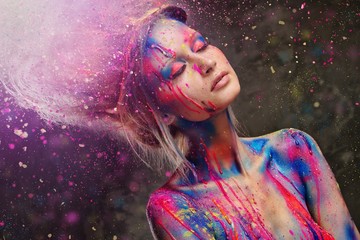 Young woman muse with creative body art and hairdo