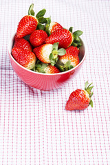 Fresh red strawberries in a bowl.