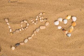 Fototapeta na wymiar Love message on sand