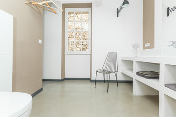 Big comfortable toilet room with chair