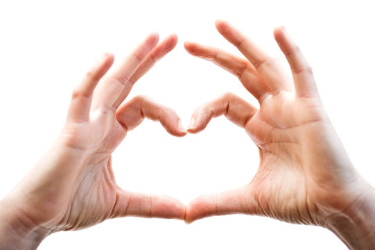Woman hands showing heart gesture, isolated