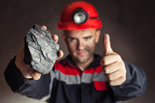 Coal miner with lump of coal