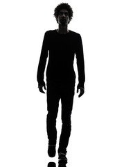 handsome african young man walking looking up silhouette