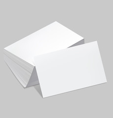 Stack of blank business card with one card in front on white bac - 60489948