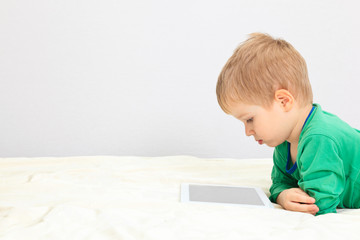 little boy with touch pad
