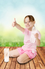 Cute little girl gives the thumbs-up to the camera