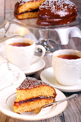 Layer spicy cake with jam and chocolate glaze