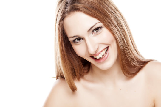 Portrait Of Beautiful Smiling Redhead Woman On White