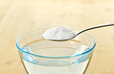 Close-up of baking soda on spoon.