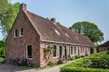 Fototapeta na wymiar Old street in the restored village of Boertange in Groningen
