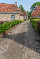 Old street in the restored village of Boertange in Groningen