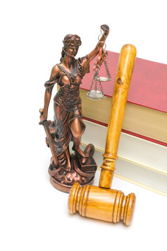 statue of justice, gavel and books on white background