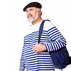 Senior man with backpack going on a trip