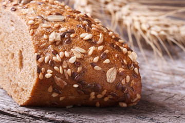 bread with seeds and nuts closeup on wooden table