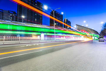 Fototapeta na wymiar light traces on traffic junctions at night