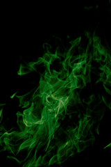 green fire on black background