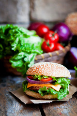 Closeup of home made burgers on wooden background
