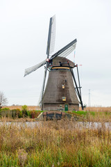 Fototapeta na wymiar Traditional Dutch windmill in winter Kinderdijk. Netherlands.