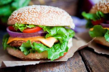 Closeup of home made burgers on wooden background