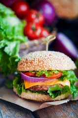 Closeup of home made burgers on wooden background