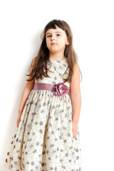 fashionable little girl in gorgeous gown.