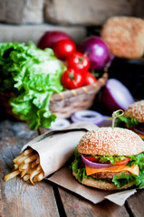 Closeup of home made burgers on wooden background