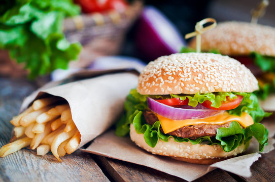 Closeup of home made burgers on wooden background