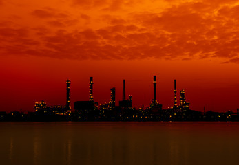 Oil refinery factory in silhuette