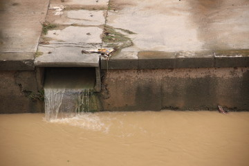 Eco disaster, polluting the river.