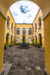 Fototapeta premium Archway to curtilage of townhall, Saint-Denis, La Réunion