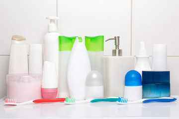 set of hygiene supplies over tiled wall