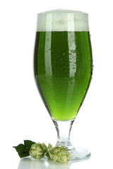 Glass of green beer and hops, isolated on white