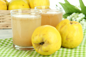 Sweet quince with juice on table close-up