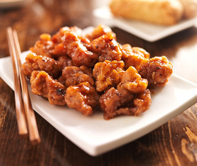 chinese orange chicken with chopsticks