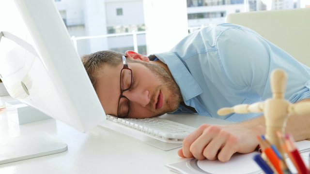 Attractive businessman sleeping
