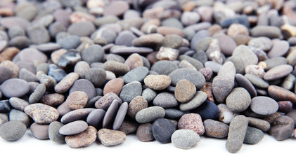 Small sea stones, isolated on white