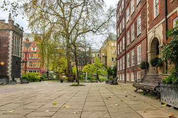 Cobbled Square with Wooden Benches in London