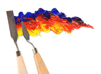Painting palette knife with paint isolated on white