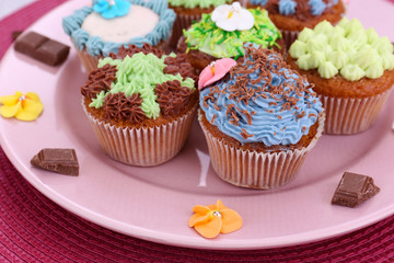 Tasty cupcakes with butter cream,