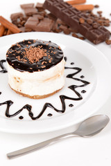 Sweet cake with chocolate on plate close-up