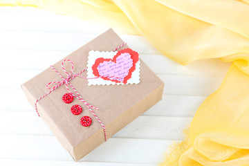 Paper gift box on wooden background