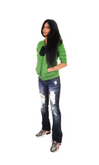 Girl standing in jeans.